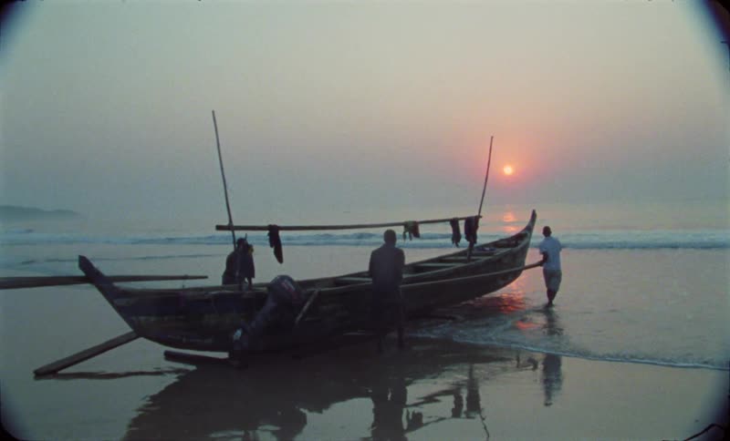 African men repairing a fishing boat