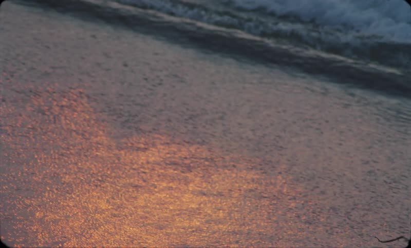 A shot of a wave coming on to the beach