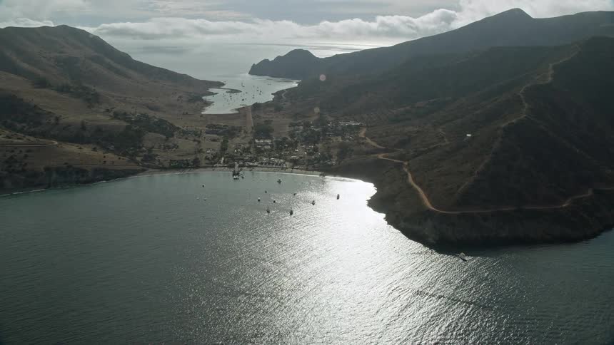 A breathtaking aerial flyby of the coastal community of Two Harbors on Santa Catalina Island showcasing the idyllic residential and industrial shores of Southern California