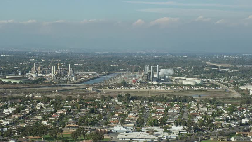 Aerial footage of the LADWP Haynes Generating Station amidst residential neighborhoods in Long Beach California
