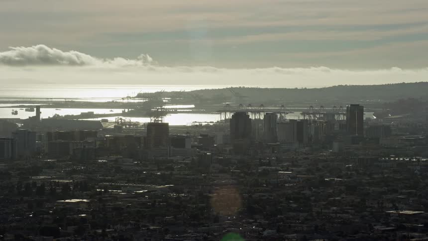 A breathtaking aerial video of office buildings in Downtown Long Beach California during a hazy day captured using Shotover F1 - showcasing the urban city side view during sunset!