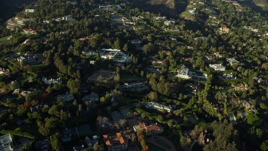 Aerial footage of luxury homes in Bel Air Southern California during sunny daytime