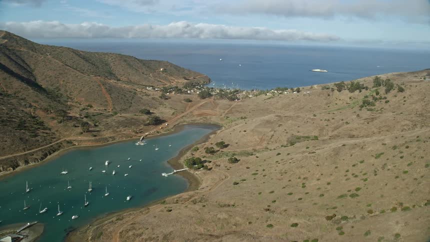 Aerial view of Two Harbors island town Catalina Harbor California with sailboats and residential homes visible along the shoreline