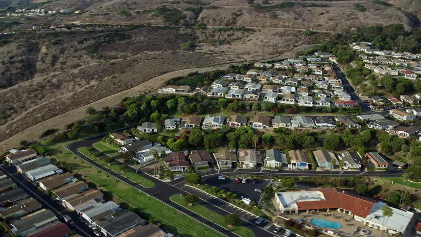 An epic aerial view of hillside homes in San Pedro California captured during a partly cloudy day