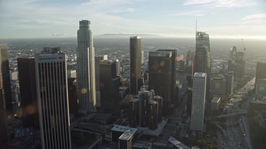 Aerial footage of the Westin Bonaventure Hotel and surrounding high-rise buildings in downtown Los Angeles during the daytime
