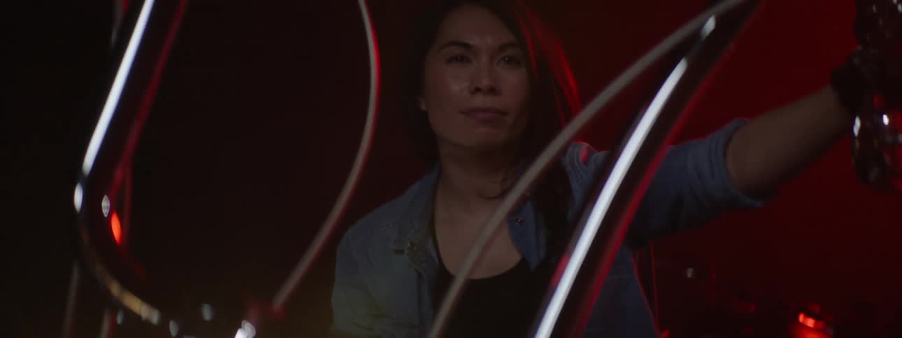 A woman sits on the motorcycle