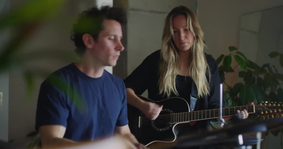 A man and woman playing music