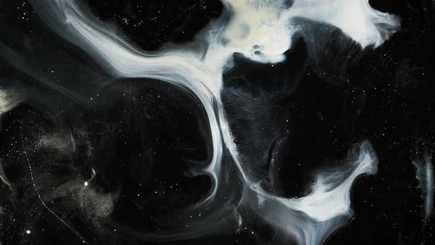 White swirls form a marble pattern against a black background
