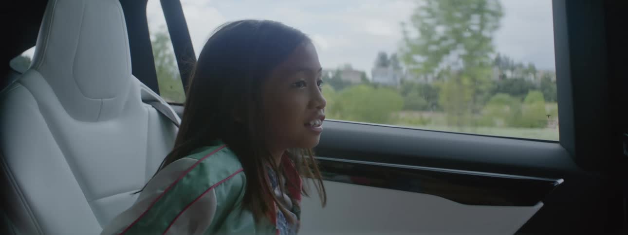 A girl talks while riding in the car