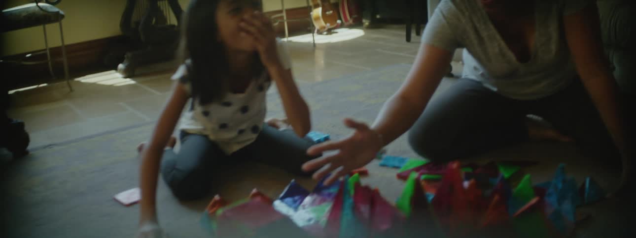 A mother and daughter playing a castle game