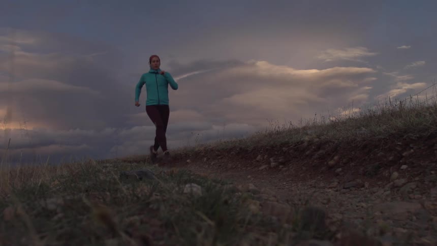 A woman jogs on the trail