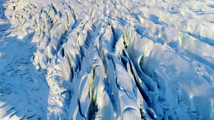 Freezing snow forms tall spikes in a field