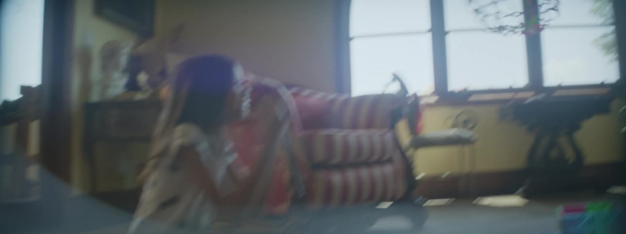 Two family members are throwing something indoors