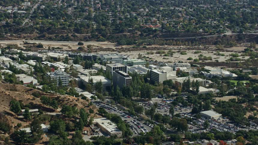 Aerial footage of scientific facility buildings at JPL in Pasadena California captured using a Shotover F1 camera system on a partly cloudy day