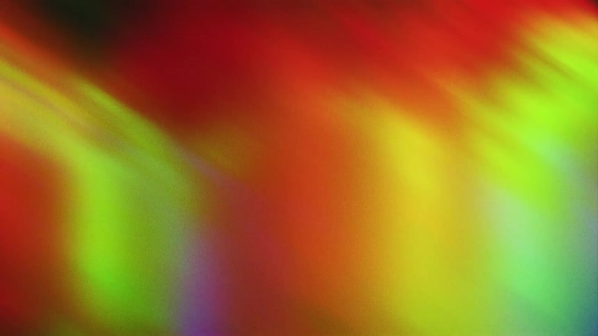 Beams of colored light move and expand as they glow in the darkness