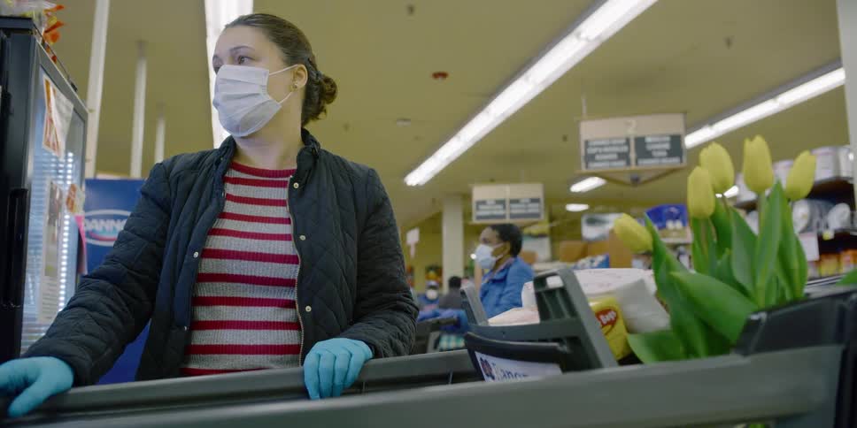People are at check out in a grocery store