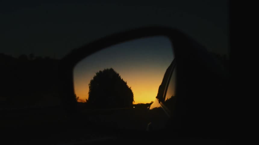 The view is of the outdoors around the night time