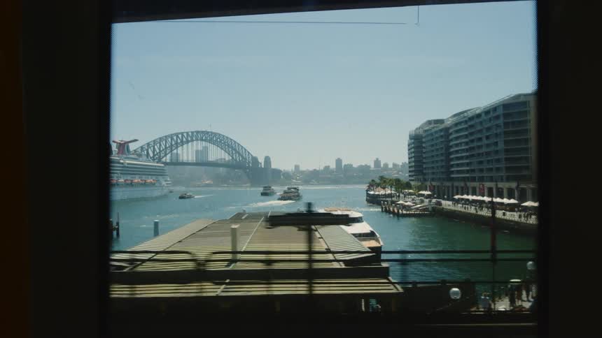 Boats travel from the pier in the city