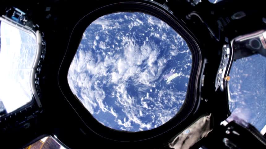 A view of earth from inside a space shuttle window