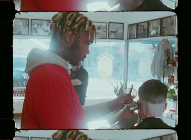 A man styling a mans hair hair