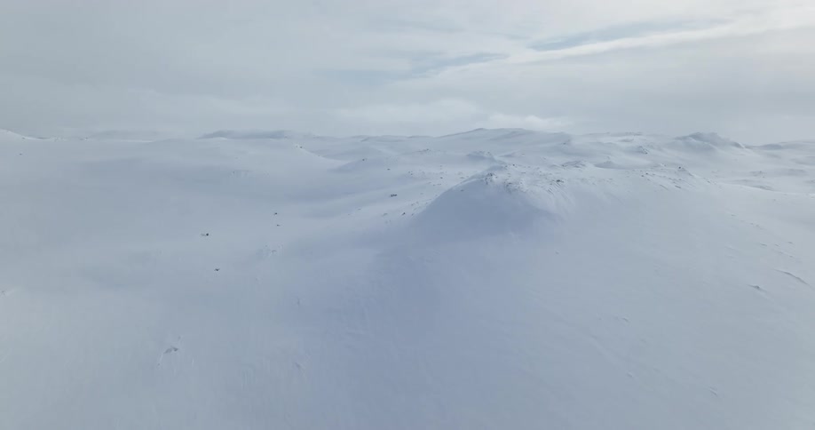 Aerial view of a mountain range during winter