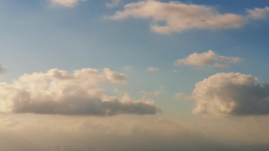 Clouds are moving in the sky at dusk