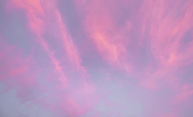 The view is of the sky and clouds in the day time
