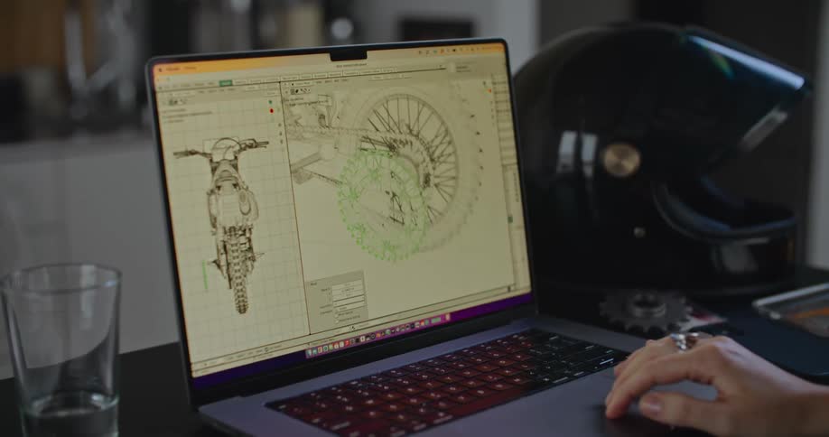 A 3D model of a dirt bike on a laptop screen
