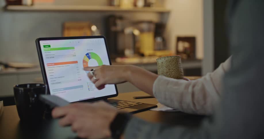 Two people are indoors and are using there laptop