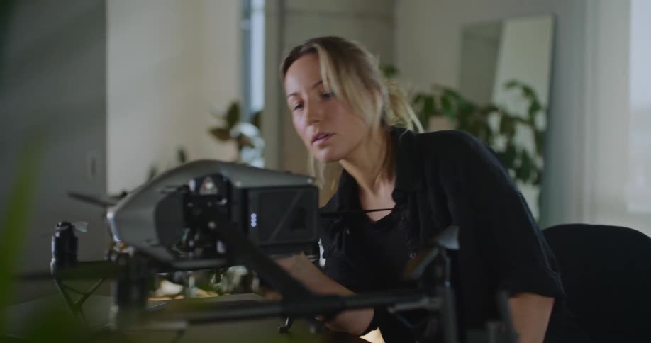A young woman is indoors around the day time