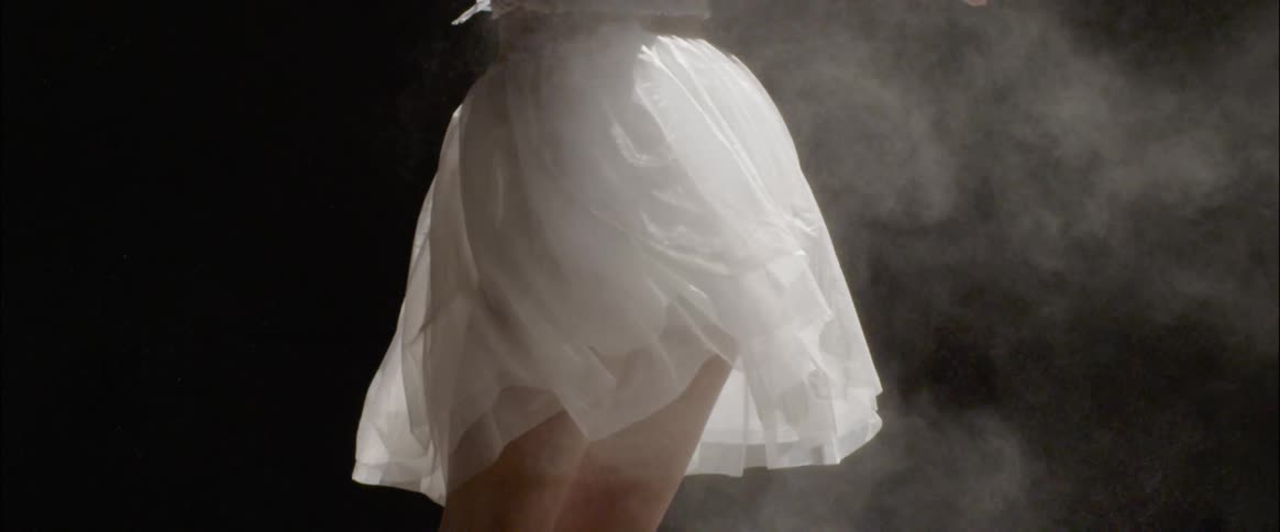 A ballet dancer spins her white skirt