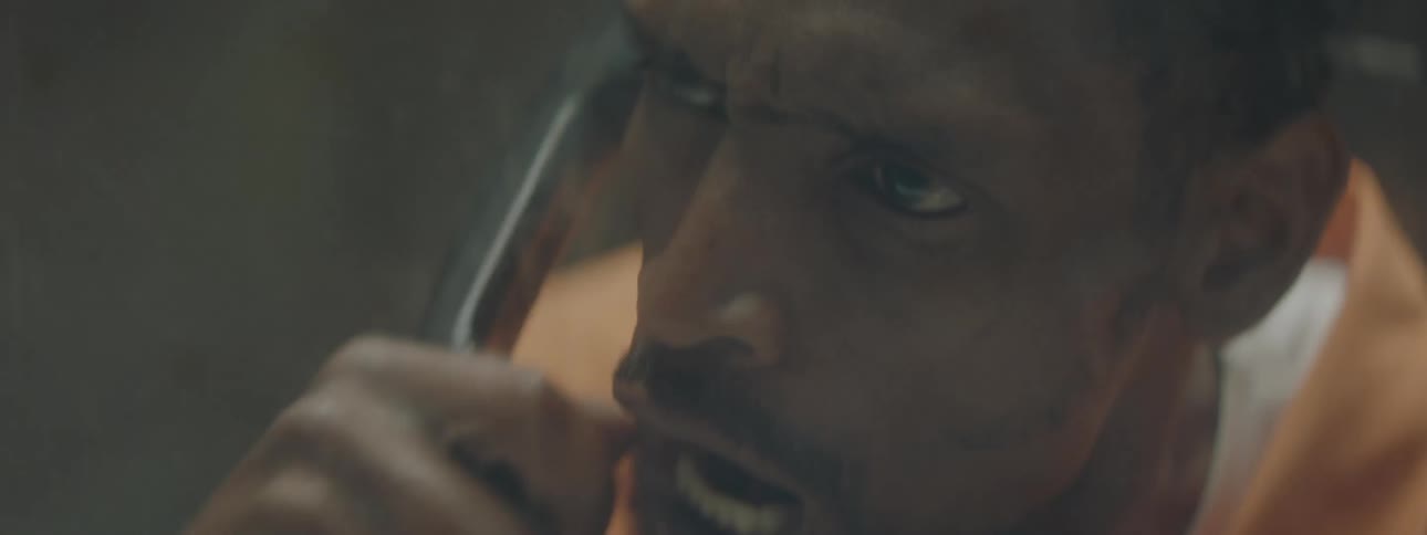 A man talks angrily into a phone