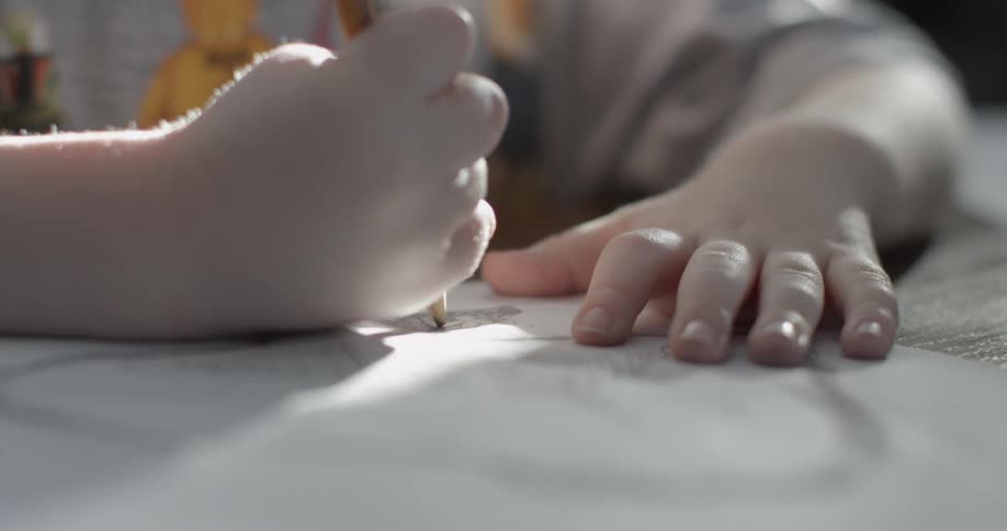 Young child using a pencil to shade