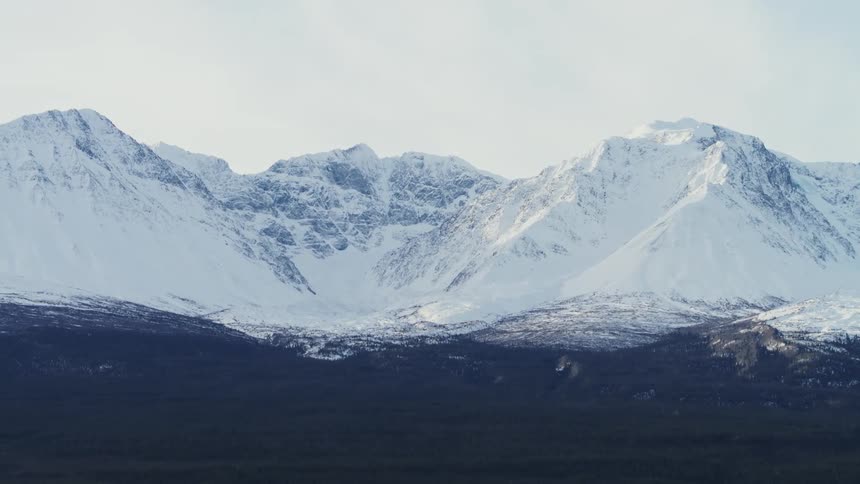Aerial view of mountains during winter is displayed
