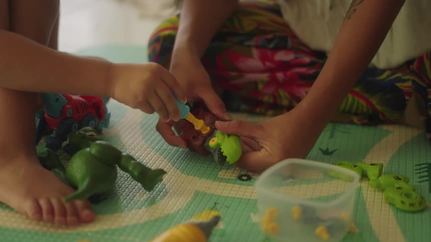 Two children play with toys