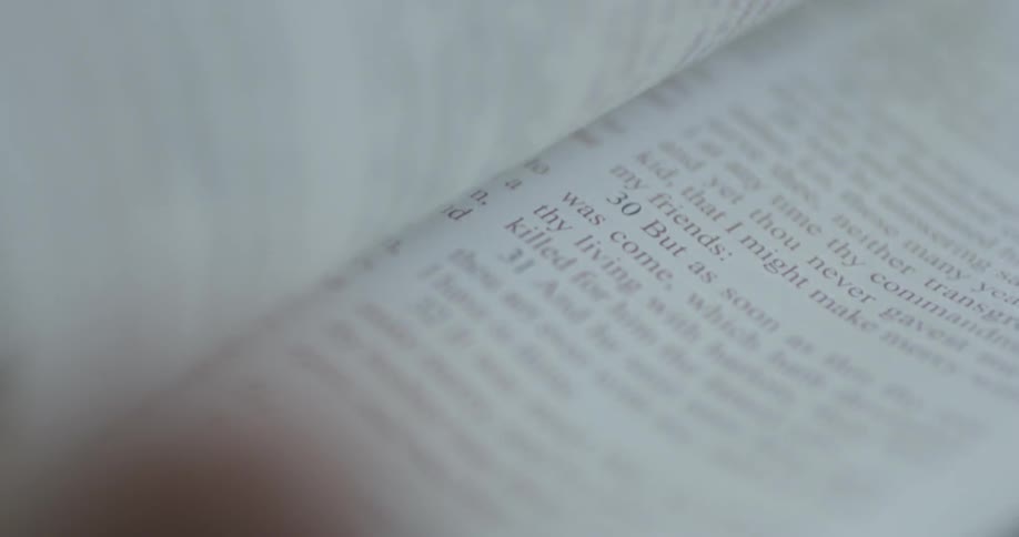 Close-up of pages being turned in a book