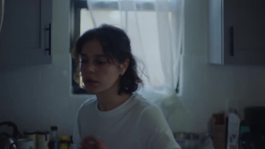 A woman is making tea