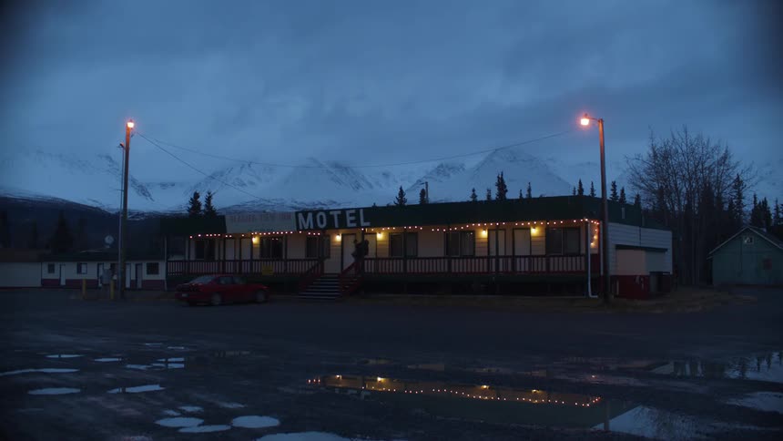 A person walks from the motel