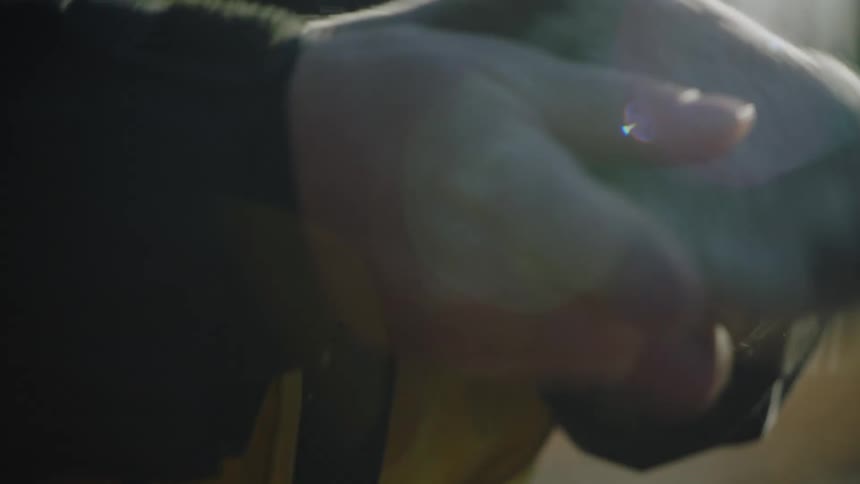 A man putting on gloves
