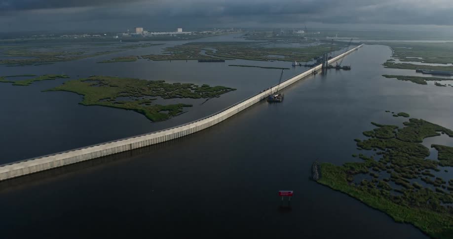 A stunning 4K aerial footage of a surge barrier and gate at sunrise in a St Bernard Parish Bayou in Louisiana