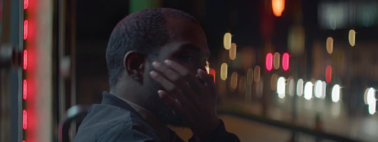 A man rubs his mouth