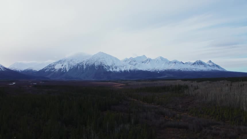 A mountain range is in the landscape at midday