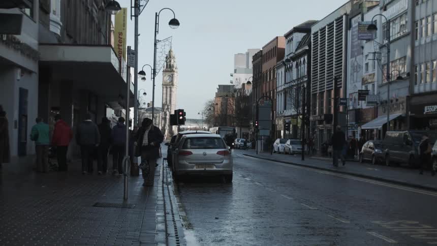 A city street is full of people