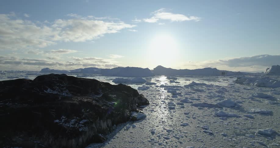 Aerial view of a frozen ocean at dusk