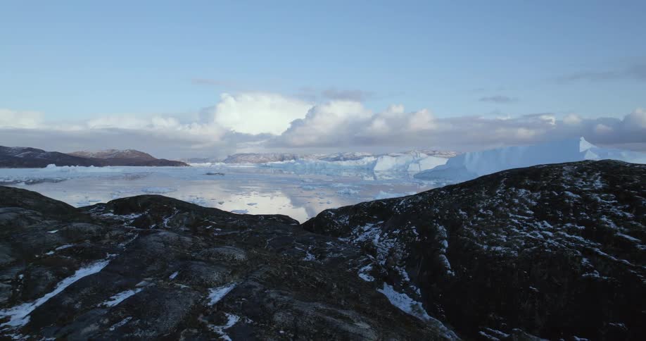 Aerial view of clouds on the horizon over mountain range