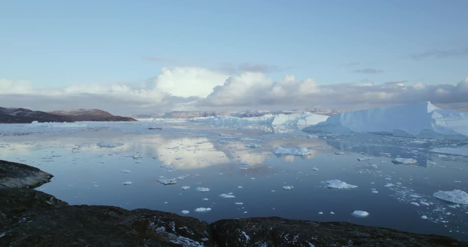Aerial view of snow melting in the ocean is displayed