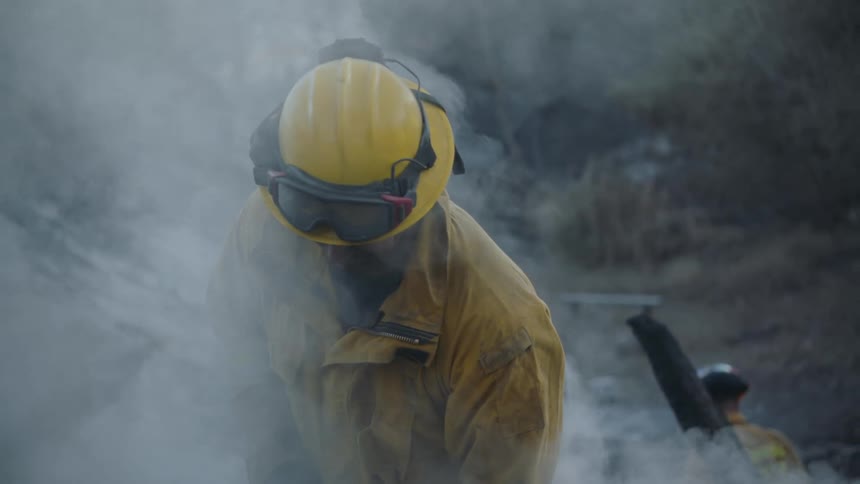 A fireman is extinguishing a fire