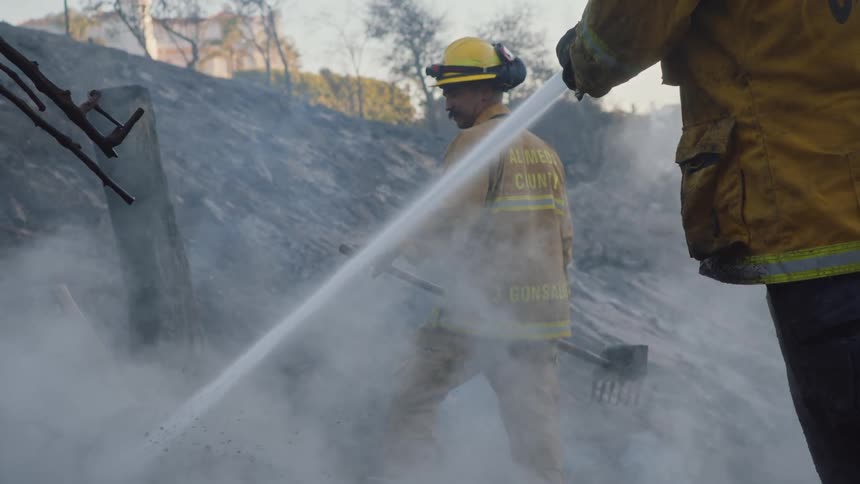 Firefighters put out a fire