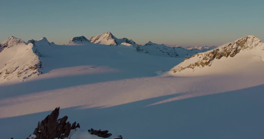 Heavy snow covers the ground in a mountain range