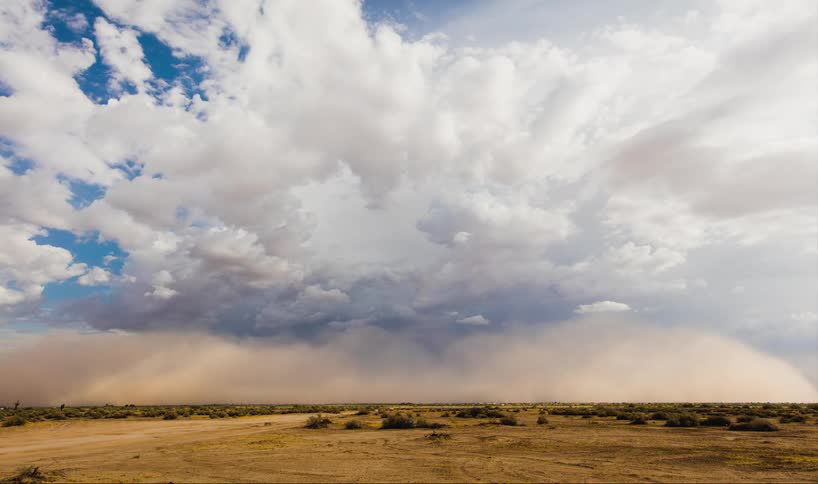 Time lapse of a dust storm moving across the plain